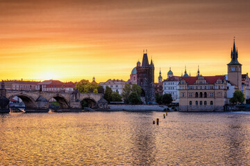 Beautiful summer sunrise view of the cityscape of Prague, Czech Republic, with Vltava River and Charles Bridge