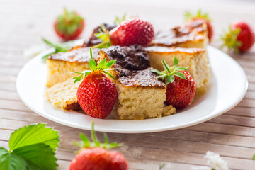prepared cottage cheese casserole with fresh strawberries