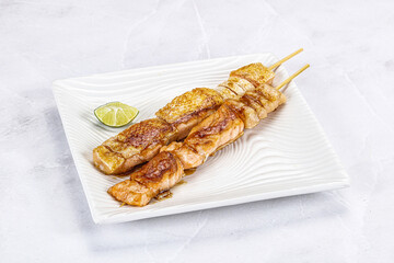 Grilled salmon skewer with sauce