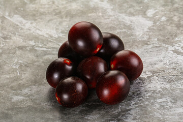 Raw ripe black kumato tomato