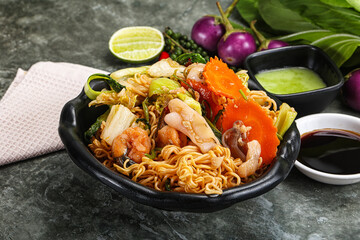 Asian cuisine - Fried noodles with seafood
