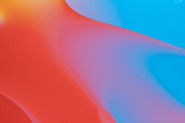 Red and blue abstract design with smooth lines and gradient colors.