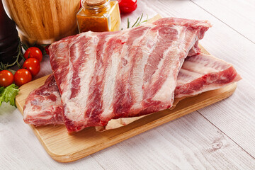 Raw pork ribs over board