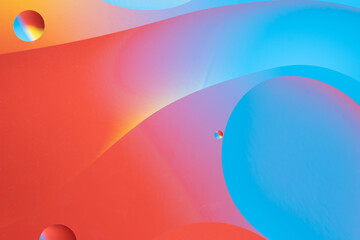 Red and blue abstract design with smooth lines and gradient colors.