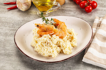 Italian risotto with prawn served thyme