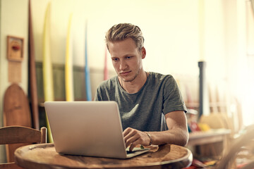 Home, thinking and man with laptop, student and research for project, decision and planning. Person, apartment and guy with pc, elearning and online reading for article, proposal and review results