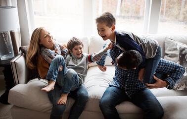 Parents, children and happy with playing on couch, talk and bonding with love, tickle and piggy...