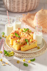 Homemade gooseberry butter cake served in sunny summer kitchen.