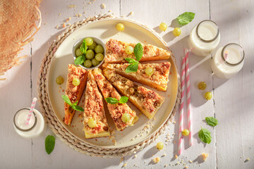 Homemade and fresh gooseberry butter cake as traditional dessert.