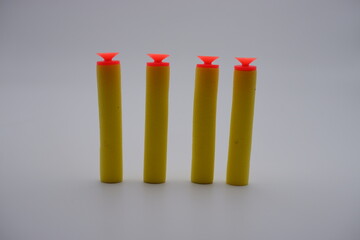 children's toy gun bullets isolated on gray background