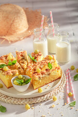 Fresh gooseberry butter cake served with milk in bottle.