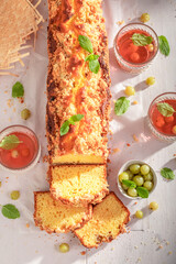 Fresh and homemade gooseberry yeast cake as summer dessert.