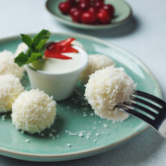 Easy vegan breakfast. Cottage cheese balls filled with cherries and coconut flakes. Healthy eating. Light background. Menu of a cafe, restaurant. Children's treat recipe. Dairy products. high protein 