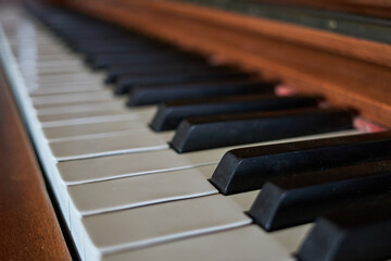Close-up of the keys of an old piano