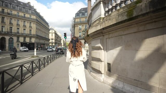 Paris, France. A girl walks through the famous streets near Opera Garnier