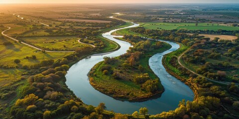 A river meanders through a green landscape. AI.