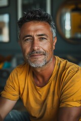 Fototapeta premium Portrait of a Middle-Aged Man with Salt-and-Pepper Hair in a Casual Setting. Generative AI.