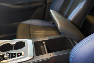 The car features a highend interior, but shows wear and tear with a armrest