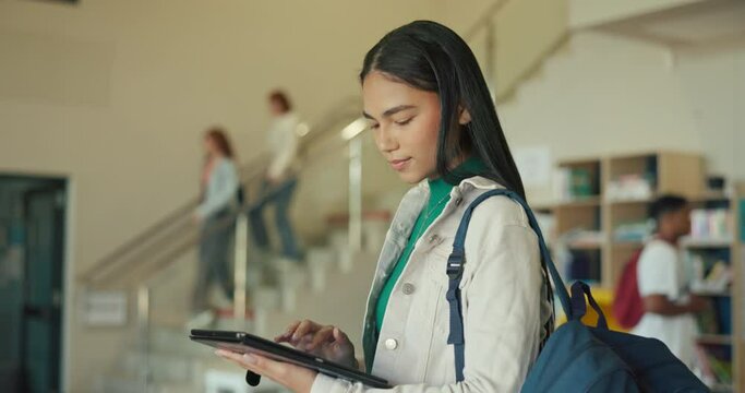 Teenager, learning and girl on tablet in high school for online information, studying or research. Education, academy campus or female student on technology for social media, internet or website faq