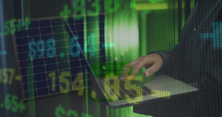 Image of financial data processing over mid section of male engineer using laptop at server room