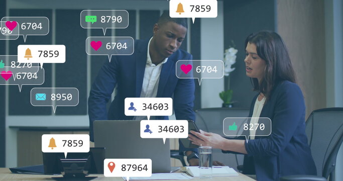 Image of notification icons with changing numbers over diverse coworkers discussing reports - Powered by Adobe