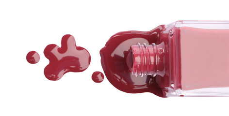 Bottle and spilled red nail polish isolated on white, top view