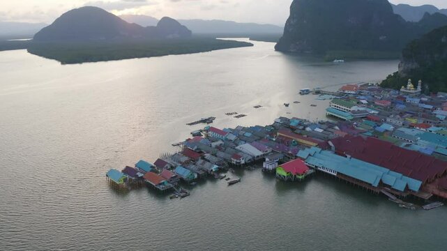 Aerial view of Koh Panyee, The Floating village urban city town houses, lake sea or river. Nature landscape fisheries and fishing tools at Pak Pha, Phang Nga, Thailand. Aquaculture farming