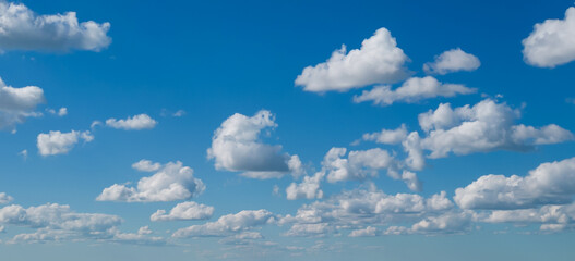 Poofy Clouds in a blue sky