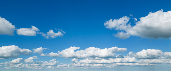 Poofy Clouds in a blue sky