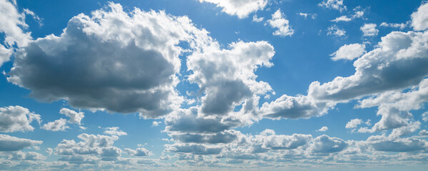 Poofy Clouds in a blue sky