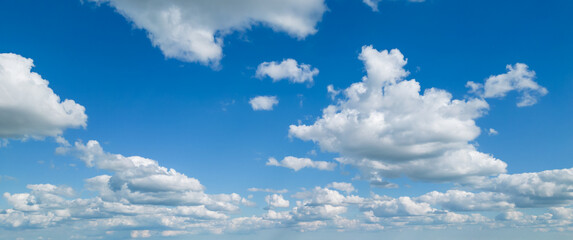 Poofy Clouds in a blue sky