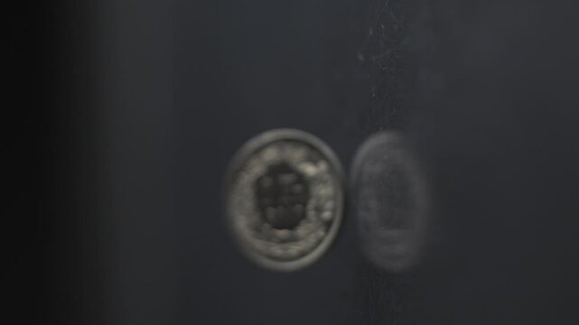 One Swiss Franc coin rotating slow motion, 1 CHF, vertical view