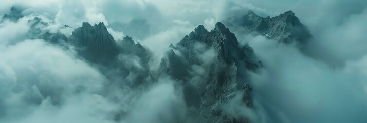 mountain peaks sticking out from the clouds