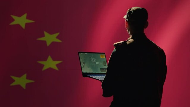 Chinese soldier using radar detecting ballistic missile attacks and conducting general space surveillance and satellite tracking. CCP agent using military laptop software preventing rockets, camera A