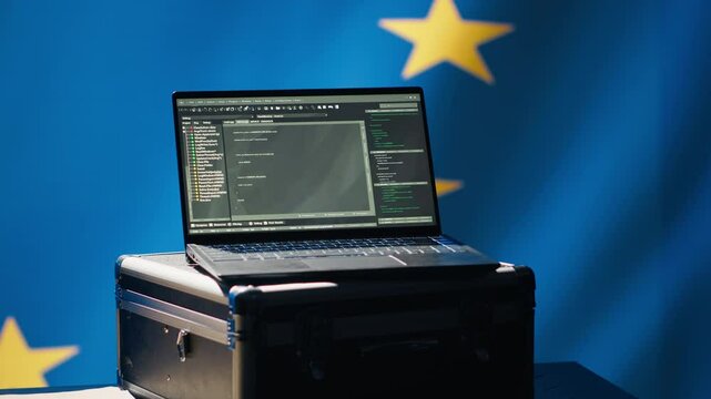 European Union intelligence agency using laptop to protect against mass propaganda tools affecting elections. EU security service engaging in psychological operations using device, camera A