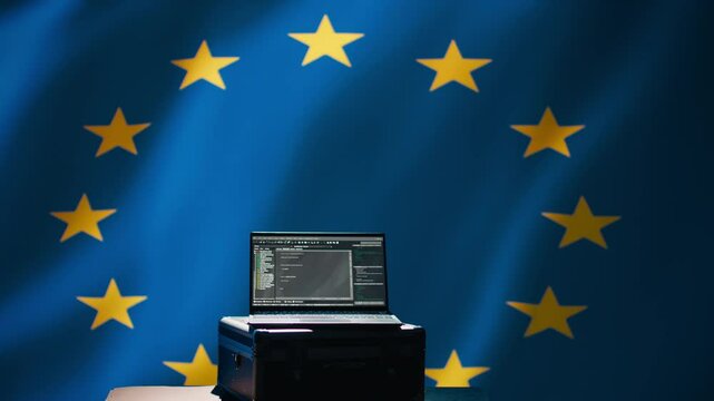 Laptop in European Union command center used by counterterrorism department to run security protocols against propaganda bots trying to destabilize democracy, isolated over EU flag, camera B