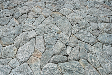 The walls of the house are made from natural stones arranged in a beautiful order.