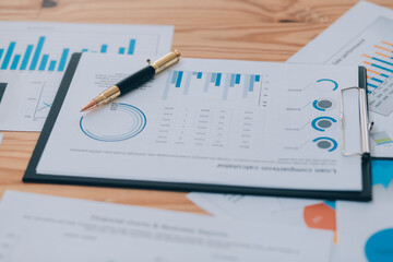 Happy young asian businesswoman sitting on her workplace in the office. Young woman working at laptop in the office.