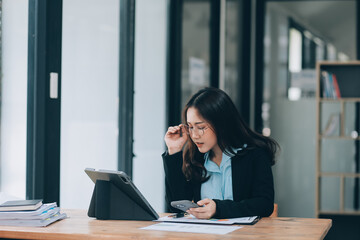 Asian woman working at the office. woman using laptop computer on desk at office