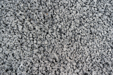 texture of gray asphalt with pebbles