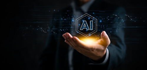Businessman holding AI hologram, representing artificial intelligence and innovation. Ideal for tech companies, futuristic concepts, data networks