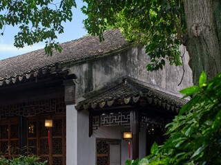 an traditional chinese style building with carved wooden decorations and lanterns