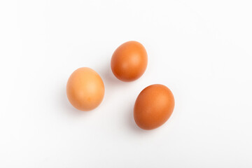 Brown eggs on a white background