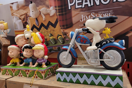 KL, MALAYSIA - 13 FEB 2024: Various selections of Snoopy character figures displayed on store shelves in Books Kinokuniya. Snoopy is an anthropomorphic beagle in the comic strip Peanuts by Charles M.