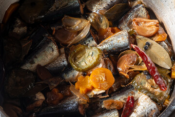 Newly cooked Spanish Sardines in a pressure cooker - A Filipino dish