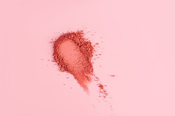 Loose blush swatch for face makeup. Universal tone. Light and delicate powder structure. pink background. A copy space. layout. mockup.