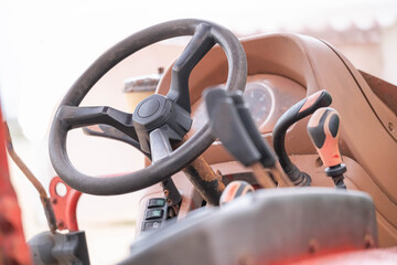Tractor steering wheel and control panel close-up