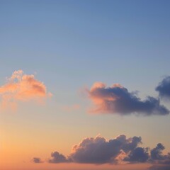 Fototapeta premium Vibrant sunset sky with fluffy clouds, capturing the transition from day to night.