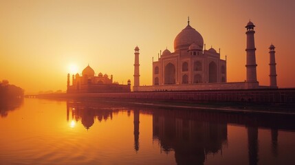 Obraz premium Architectural marvel: The Taj Mahal in India, illuminated by a golden sunset, illustrating its beauty and prominence as a major tourist site