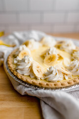 Creamy banana pie slice with whipped topping